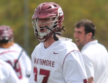 Midfielder Braeden DeWan ’16 (center) celebrates the team’s 7-5 win over Dickinson College April 23.